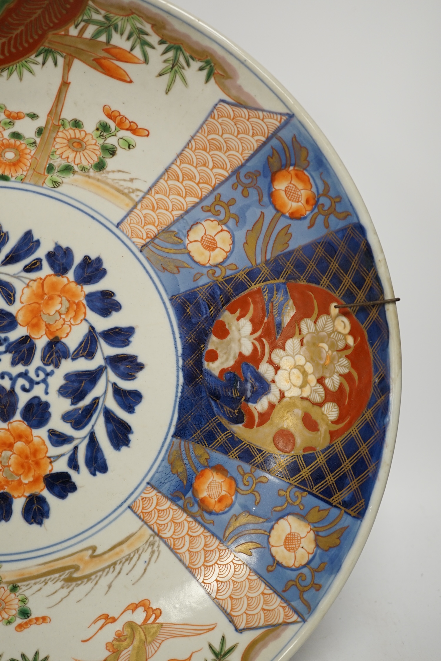 A pair of Japanese cloisonné enamel ‘dragon’ vases and a Japanese Imari dish, 39.5cm diameter (3). Condition - fair to good